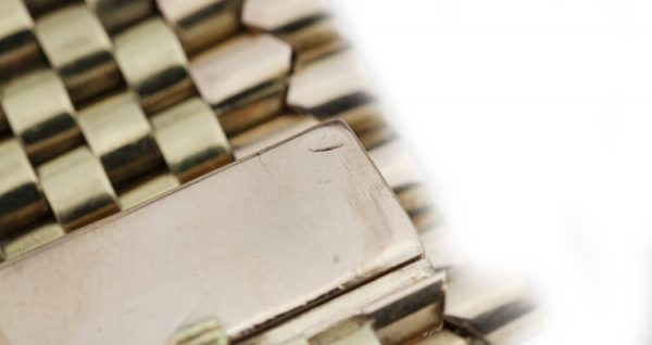 Vintage Tiffany and Co 18ct Gold Belt Buckle Style Bracelet set with rubies and diamonds. Circa 1940s.