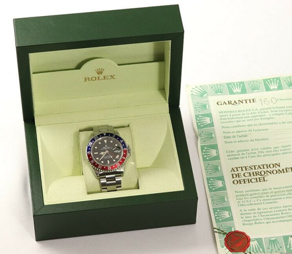 Rolex GMT Master 16700 Stainless Steel 40mm Automatic Watch, black dial, Pepsi red and blue rotating bezel, 24 hour hand, date indicator and sapphire crystal. Stainless steel Oyster bracelet. With Rolex box and papers. Purchased in 1996.