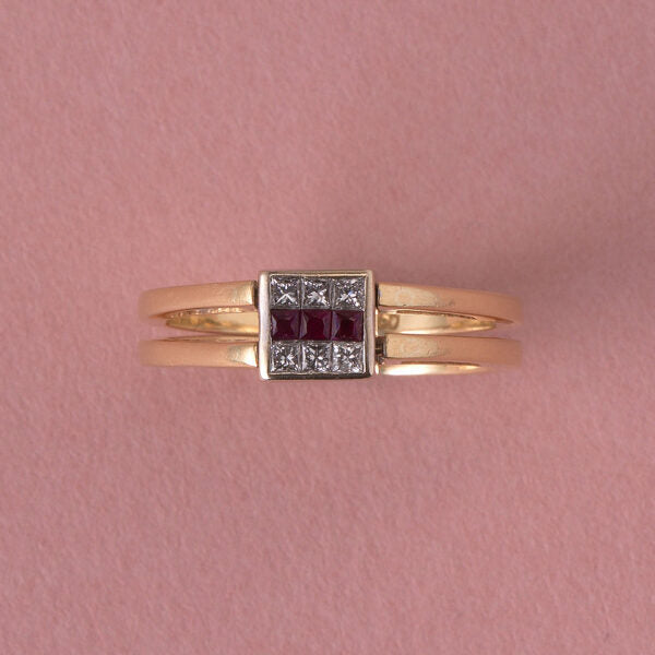 Vintage Princess Cut Diamond Reversible Ring with Sapphires or Rubies; once side set with six princess-cut sapphires in two rows flanking a line of princess-cut diamonds in the middle, the other side set with six-princess cut diamonds in two rows flanking a line of princess-cut rubies, in 18ct gold, Italy, Circa 1980