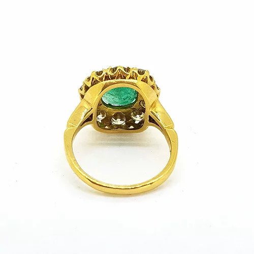Victorian Style Emerald and Old Cut Diamond Cluster Ring; featuring a central 2.50ct cushion cut emerald surrounded by 2.00cts old-cut diamonds, in 18ct yellow gold