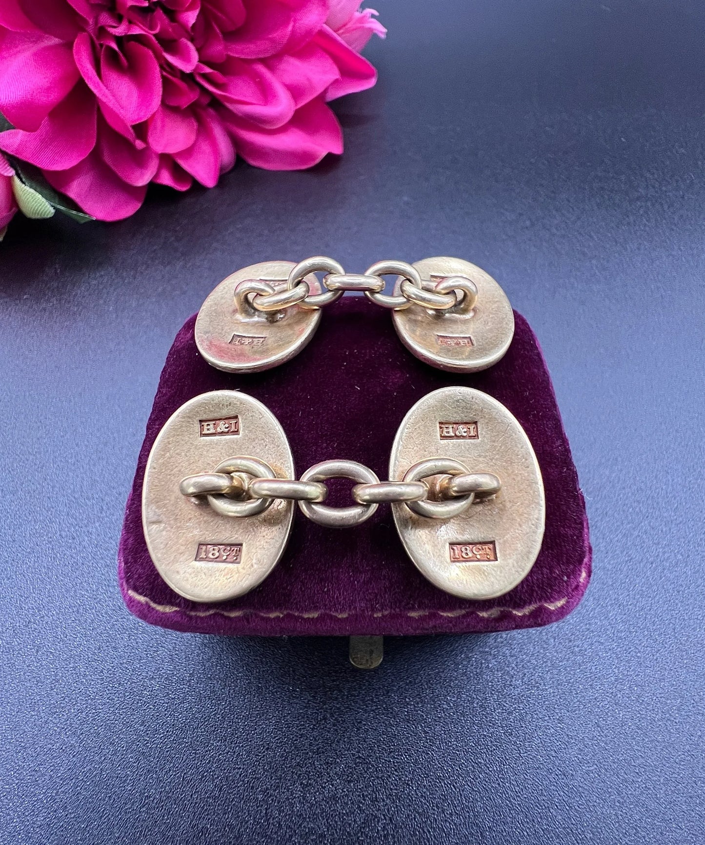 A pair of yellow gold cufflinks with chain link fittings, stamped 18CT