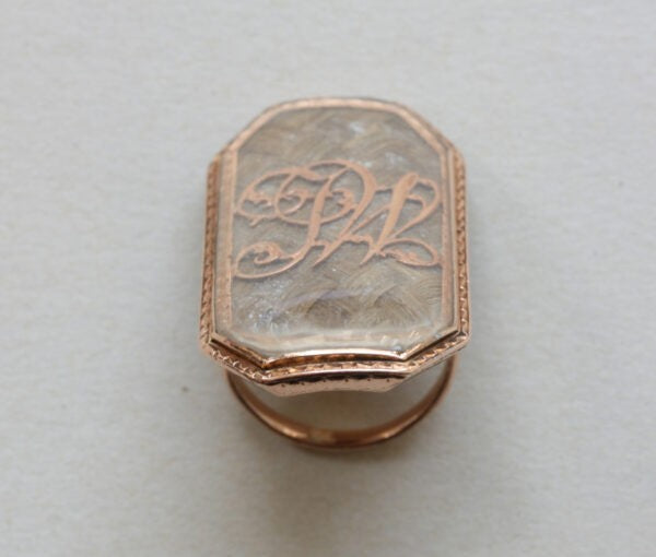18th Century Antique Octagonal Rose Gold Mourning Ring; with large octagonal panel containing woven hair and bearing the initials JW in gold