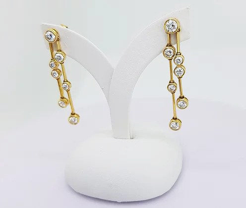 Contemporary Diamond Drop Earrings, 1.40 carat total, colour G, brilliant cut diamonds collet set in 18ct yellow gold, with 18ct gold links