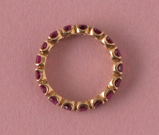 French Ruby Full Eternity Ring in 18ct Yellow Gold; set with seventeen round facetted natural heated rubies, 2.89 carat total. Made in France