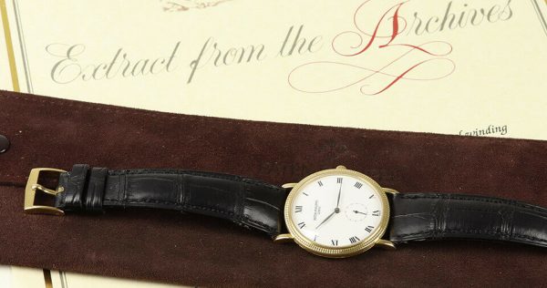 Patek Philippe Calatrava 18ct Yellow Gold 33mm Watch, 3919, porcelain white dial, Roman numerals, seconds sub-dial at 6, manual movement. With Patek Philippe strap, pouch and extract.