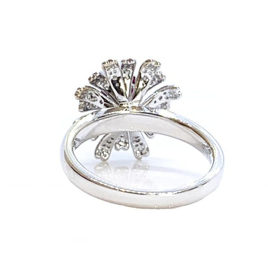 Burmese Ruby and Diamond Flower Cluster Dress Ring; 1.28ct oval faceted Burma ruby surrounded by diamond-set petals, in 18ct white gold