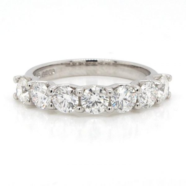 Diamond and Platinum Seven Stone Half Eternity Ring; platinum half eternity ring set with seven claw-set brilliant-cut diamonds, 1.45 carat total