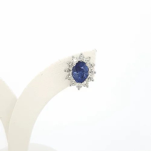 Classic Pair of Sapphire and Diamond Oval Cluster Stud Earrings; 2.21cts oval faceted sapphires surrounded by 0.82cts brilliant cut diamonds, in 18ct white gold