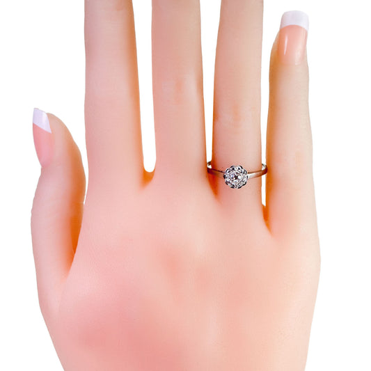 A floral shaped diamond cluster ring in platinum, modelled on a hand