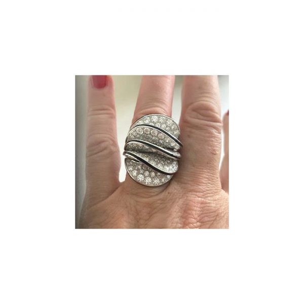 Cartier Paris Nouvelle Vague Diamond and Enamel Cocktail Ring; pavé set with 5.00 carats of round brilliant-cut diamonds in five wave-shaped formations, the edges with black enamel accents, in 18ct white gold, Signed