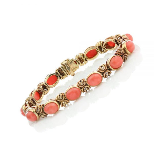 Van Cleef and Arpels Vintage Coral and 18ct Gold Bracelet; set with oval cabochon-cut coral. Made in France, Paris, Circa 1970s