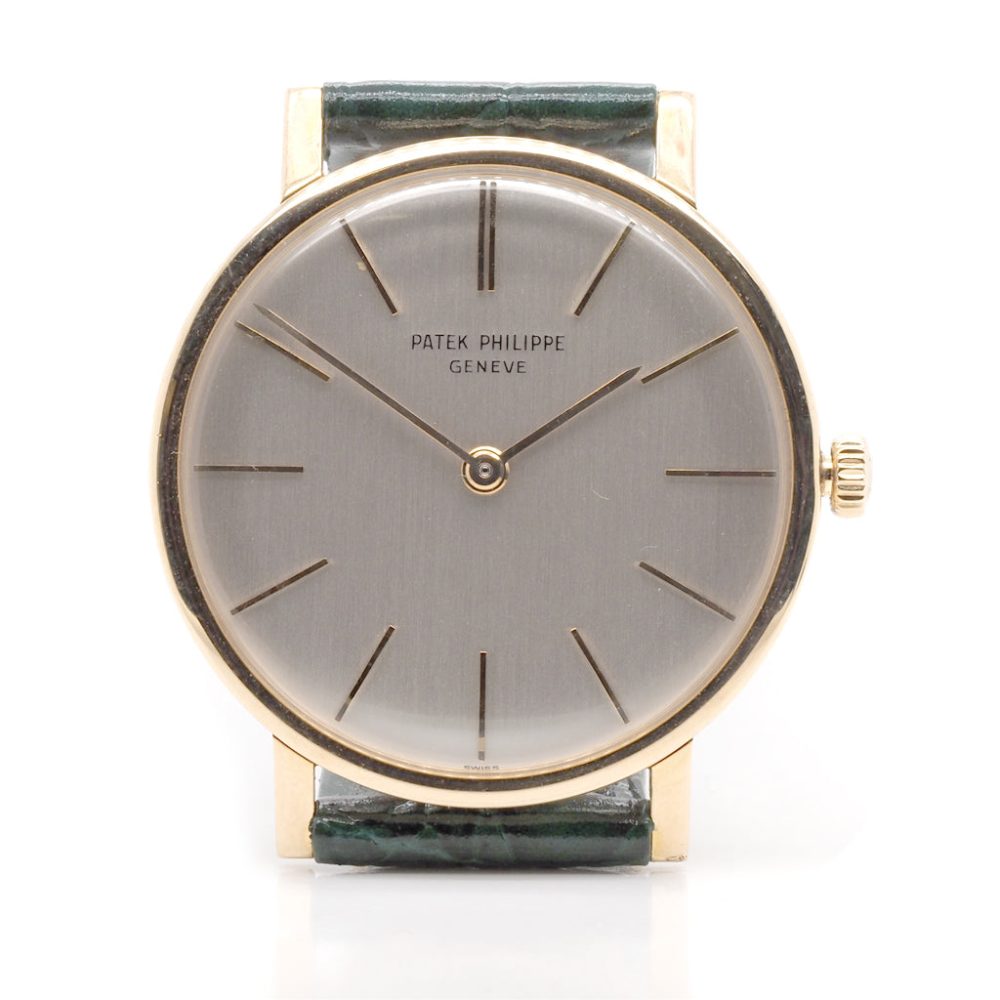 Vintage Patek Philippe Calatrava 18ct Gold 3426 Manual Wind Watch, 18ct yellow gold case with white dial and baton hour markers on a green leather strap. Circa 1962