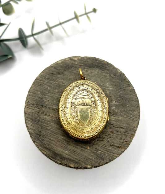 Early Victorian 15 Carat Yellow Gold Floral Engraved Oval Shaped Locket, Circa 1860