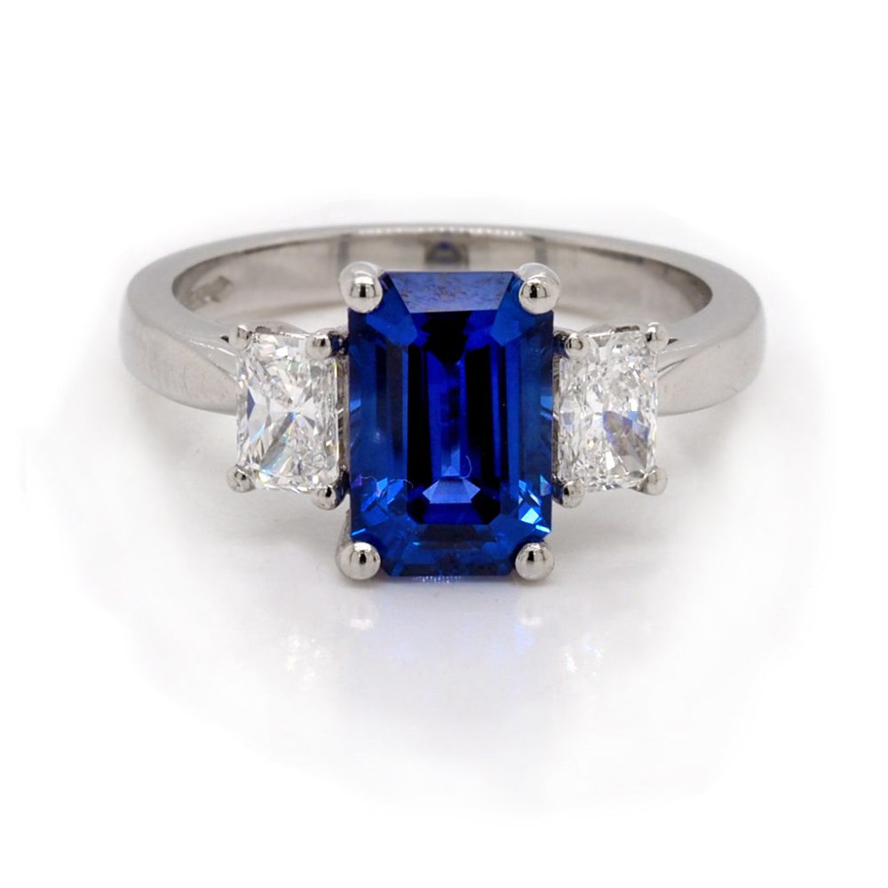 Sapphire and diamond three stone ring in platinum.