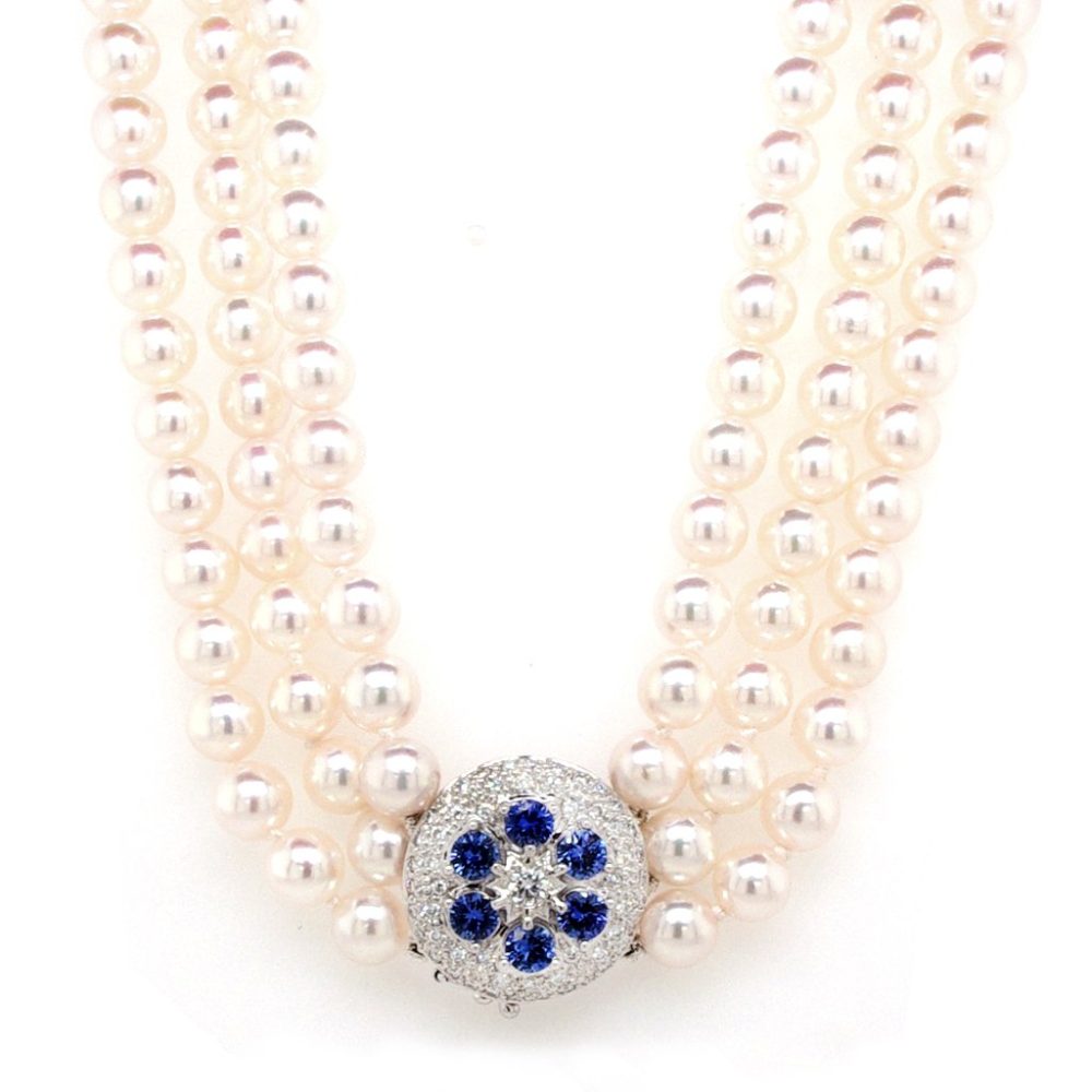 Pearl necklace with white gold, diamond and sapphire clasp.