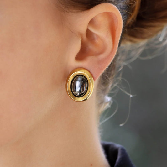 Vintage Angela Cummings hematite earrings set in yellow gold.