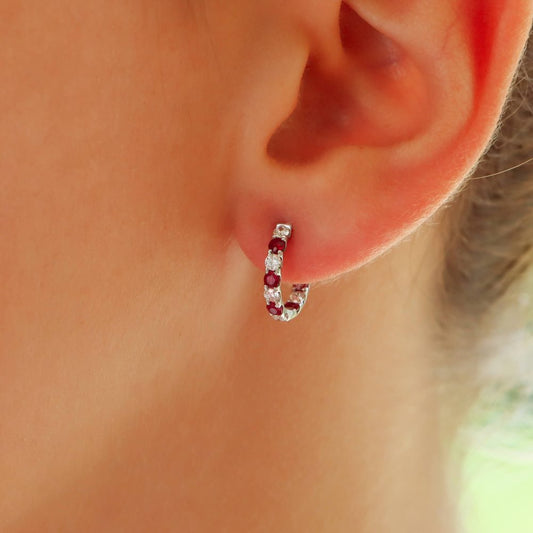 Ruby and diamond hoop earrings in white gold.