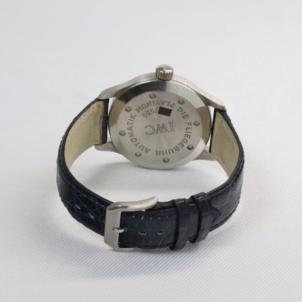 IWC Pilot Aviator Mark II Limited Edition Automatic Watch; 36mm titanium case with blue dial, Arabic numerals and date aperture, on a leather strap with platinum buckle, comes with IWC box. One of 500 examples made in 1993.