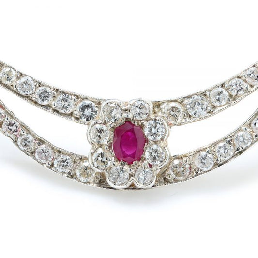 Antique Edwardian Ruby and Old Cut Diamond Cluster Crescent Brooch; oval Burma ruby and old-cut diamond cluster on diamond-set split crescent