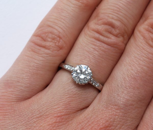 Diamo1.28ct Brilliant Cut Diamond and Platinum Solitaire Engagement Ring, colour D, clarity IF, HRD certificate, heart decorated mountnd and Platinum Solitaire Engagement Ring; internally flawless 1.28ct round brilliant-cut diamond, colour D, with HRD certificate, flanked by brilliant cut diamonds, heart decorated mount