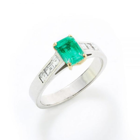 Vintage Emerald Cut Colombian Emerald and Diamond Ring; central 0.90ct certified Colombian emerald-cut emerald flanked by princess-cut diamond set shoulders, in 18ct white gold. Circa 1980s-1990s. With GCS certificate