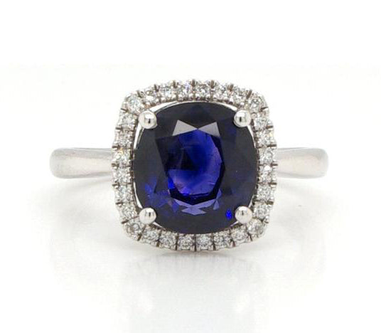 Cushion Cut 3.53ct Sapphire and Diamond Cluster Ring, four-claw set, on a plain platinum shank.