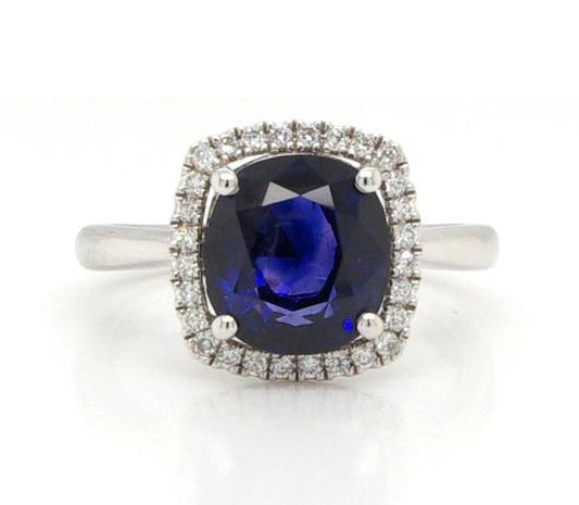 Cushion Cut 3.53ct Sapphire and Diamond Cluster Ring, four-claw set, on a plain platinum shank.