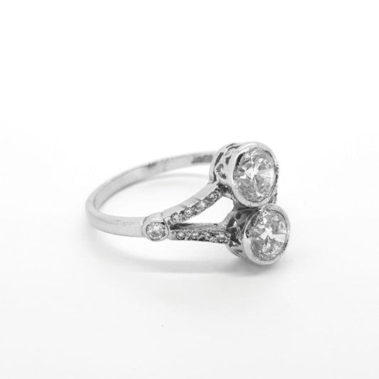 Toi et Moi Diamond Two Stone Ring; two main collet-set diamonds accented with diamond-set split shoulders, 1.60 carat total, in 18ct white gold