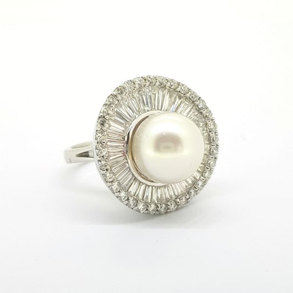 South Sea Pearl and Diamond Cluster Ballerina Ring; A beautiful South Sea pearl is dressed with a 'Tutu' of baguette and brilliant cut diamonds, 18ct white gold