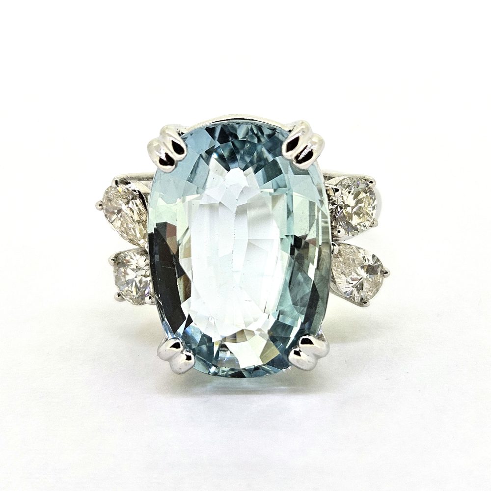 9.95ct Aquamarine and Diamond Statement Cocktail Ring, 9.95ct oval aquamarine accented with sparkling diamonds to each side in 18ct white gold