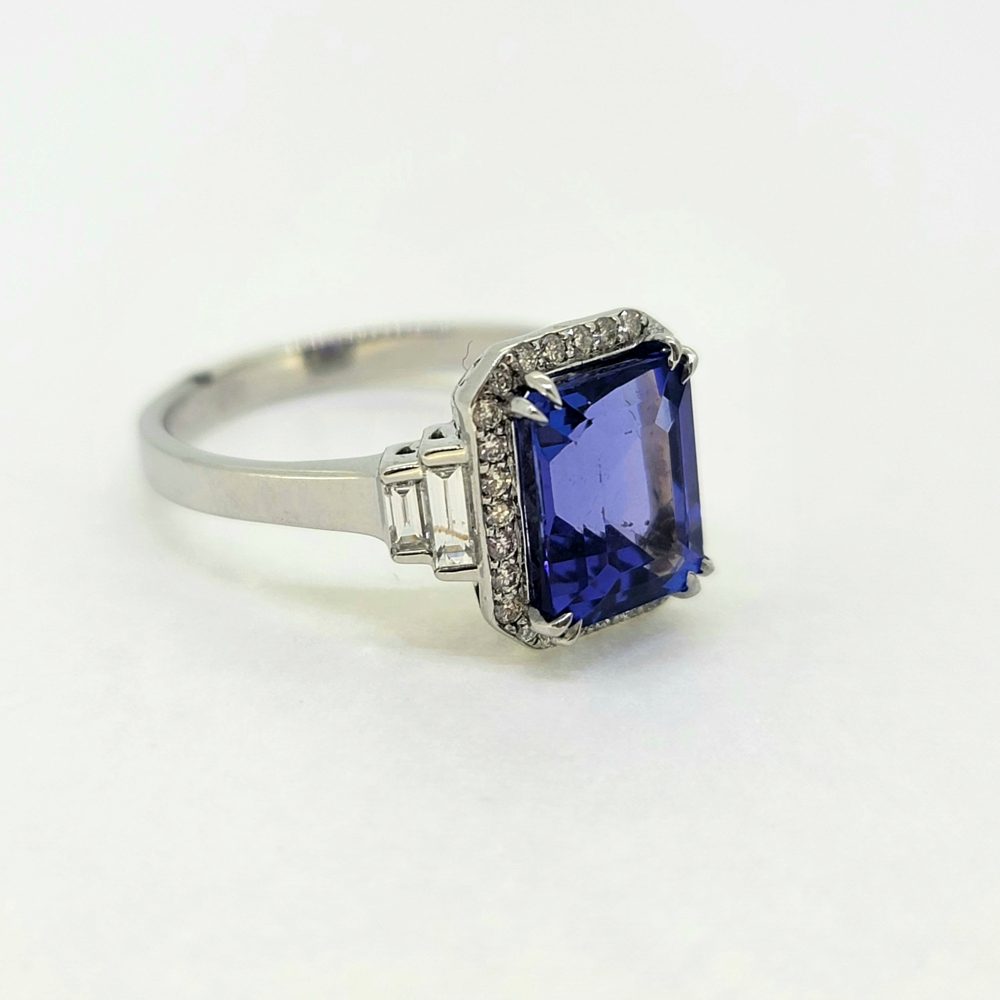 2ct Emerald Cut Tanzanite and Diamond Cluster Engagement Ring in Platinum with Baguette Diamond Shoulders