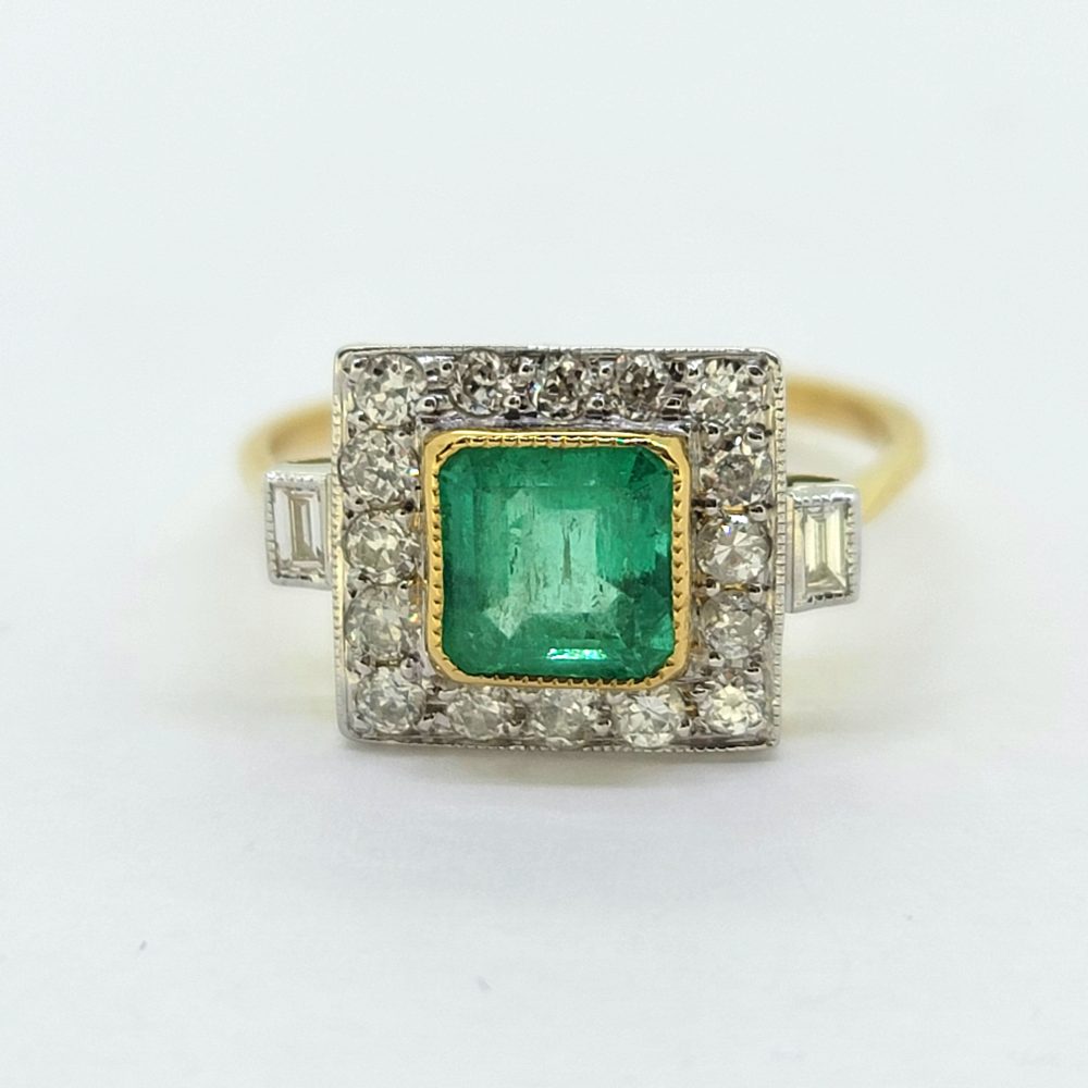 1.20ct Square Emerald and Diamond Cluster Engagement Ring, 1.20ct square-cut emerald surrounded by a border of diamonds with baguette-cut diamond to each shoulder in 18ct yellow and white gold