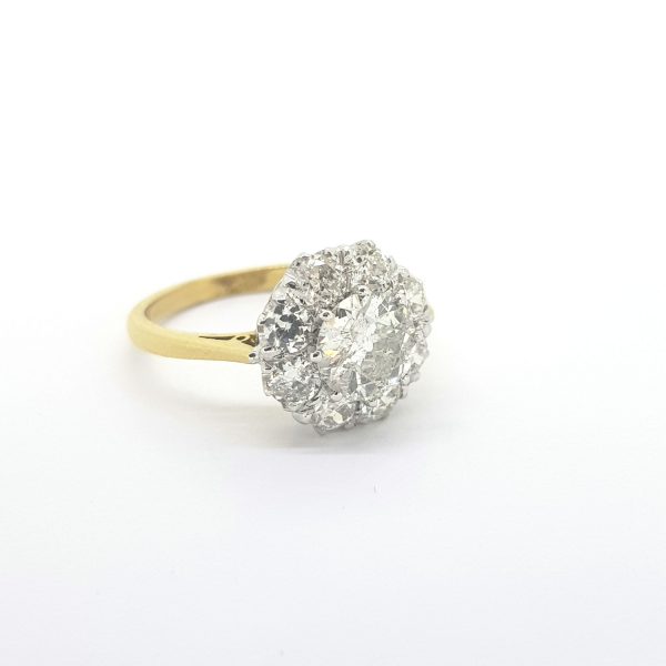 Old Cut Diamond Cluster Ring; central 1ct old-cut diamond encompassed within an old cut diamond surround, 2.00 carat total, in 18ct yellow gold