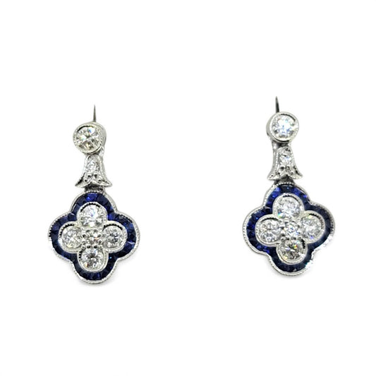 Diamond and Sapphire Quatrefoil Cluster Drop Earrings, Diamonds arranged in a quatrefoil design surrounded by calibre sapphire border with diamond stud tops