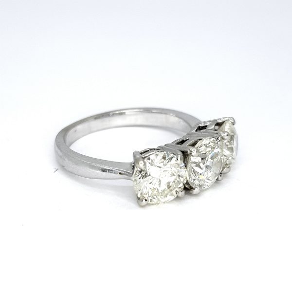 Diamond Three Stone Ring in 18ct White Gold, 3.73 carat total, central 1.30 carat round brilliant-cut diamond flanked by diamonds totalling an additional 2.43 carats