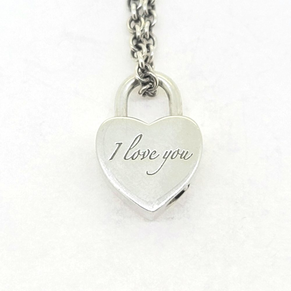 Vintage Tiffany and Co Silver Heart Padlock Charm Pendant with Chain, opening heart padlock charm engraved with 'I Iove You' on one side on a silver chain