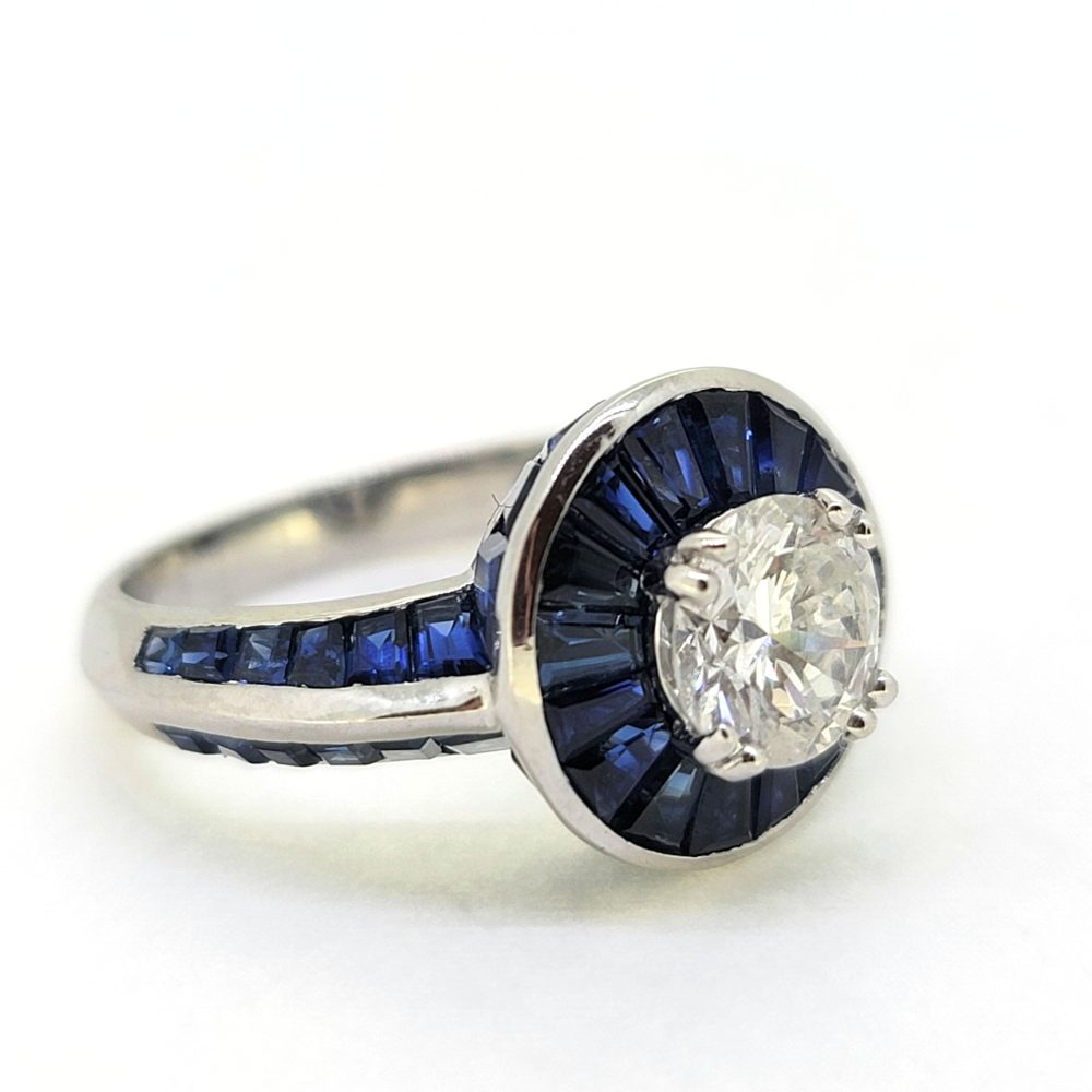 1ct Old Cut Diamond and Sapphire Target Cluster Engagement Ring, 1.01ct old-cut diamond surrounded by halo of tapered baguette cut sapphires in 18ct white gold