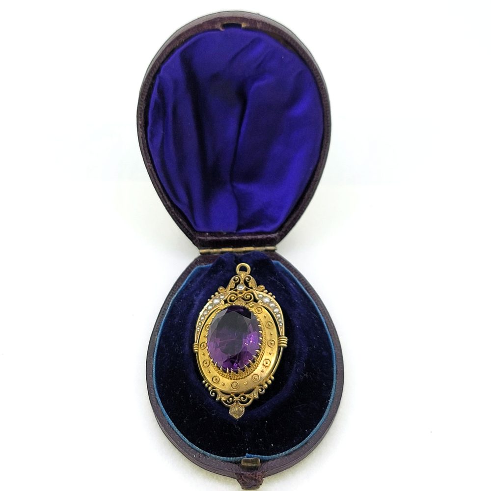 Victorian Antique Amethyst and 15ct Gold Etruscan Brooch with detailed pearl top edge, Secured by a single pin