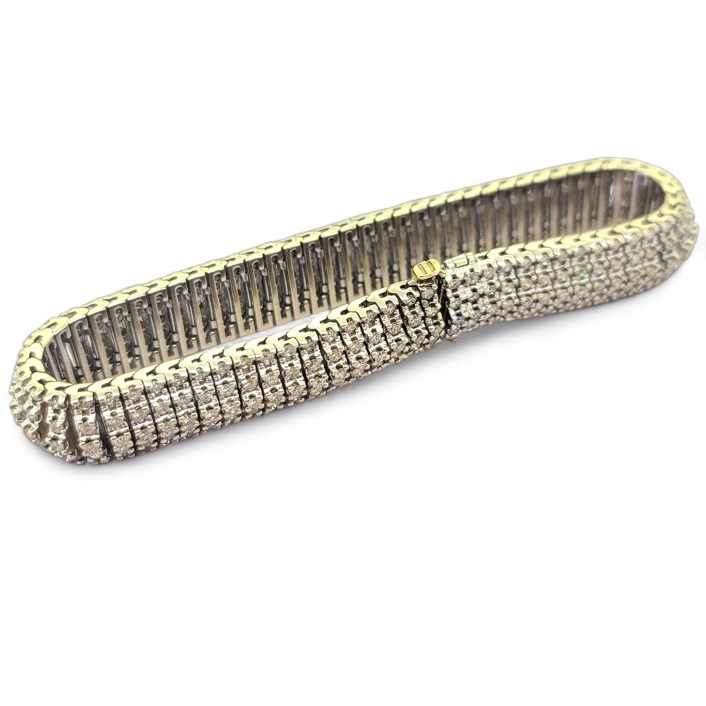 Diamond Bracelet in 18ct White Gold, 12 carat total, composed of multi rows of sparkling round brilliant-cut diamonds totalling an estimated 12 carats