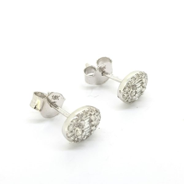 Diamond Cluster Stud Earrings; each earring features three central baguette-cut diamonds with a brilliant-cut diamond surround, 0.33 carat total, in 18ct white gold