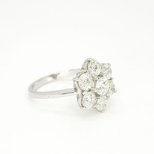 Diamond Daisy Floral Cluster Ring; seven round brilliant-cut diamonds, 2.30 carat total, claw-set and mounted to a plain 18ct white gold shank