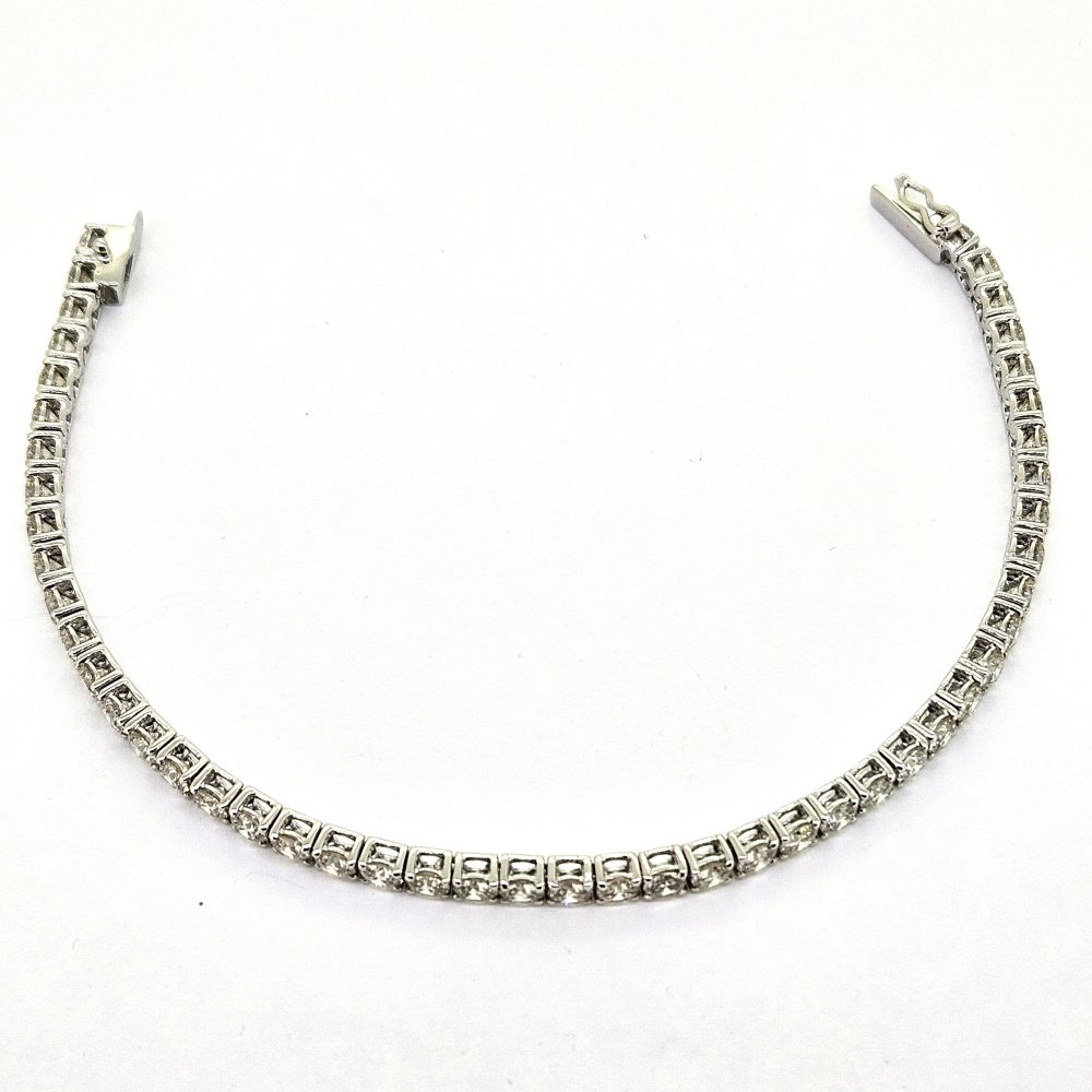 7.56ct Diamond Line Bracelet in 18ct Gold, timeless diamond tennis bracelet 7.56 carats round brilliant-cut diamonds claw set in articulated settings in 18ct white gold