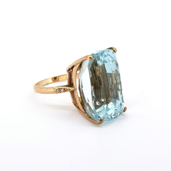 Vintage Blue Topaz and Diamond Cocktail Ring in 18ct Rose Gold; featuring a high set blue topaz dress ring with diamond accents to each shoulder