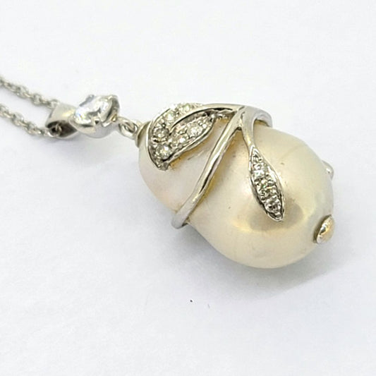 Southsea Pearl and Diamond Pendant with Chain, cultured South Sea pearl with 18ct white gold leaf wrap around design set with sparkling diamonds