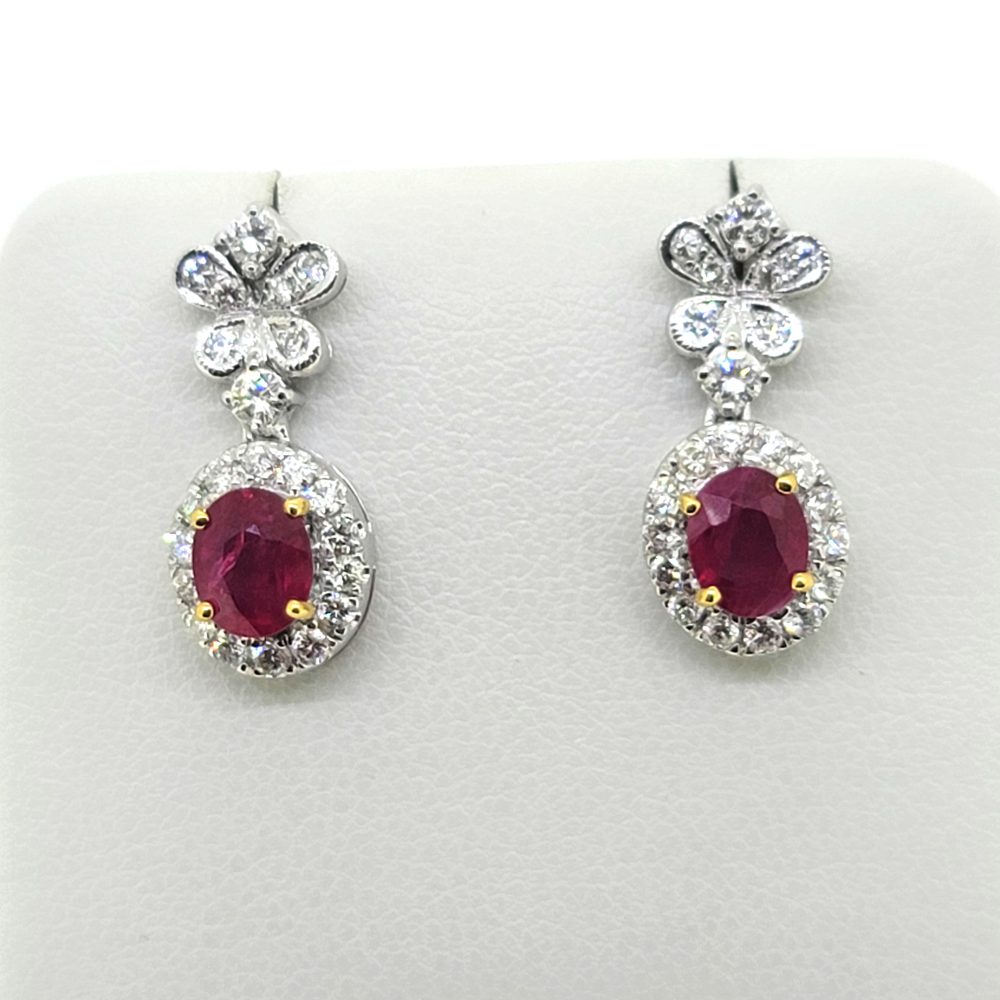 1.20ct Oval Ruby and Diamond Cluster Drop Earrings, oval red rubies surrounded by halos of round brilliant-cut diamonds suspended from butterfly shaped tops set with sparkling diamonds in 14ct white gold
