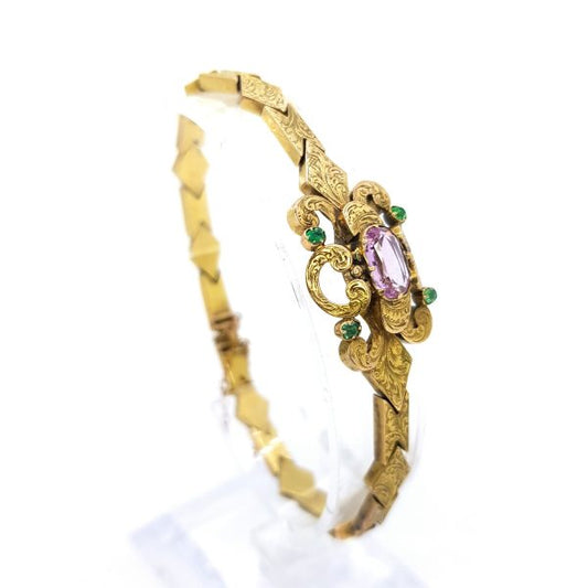Antique Victorian Pink Topaz and Emerald set 15ct Gold Bracelet; central oval faceted pink topaz is set within scrolled design with a circular cut emerald to each corner