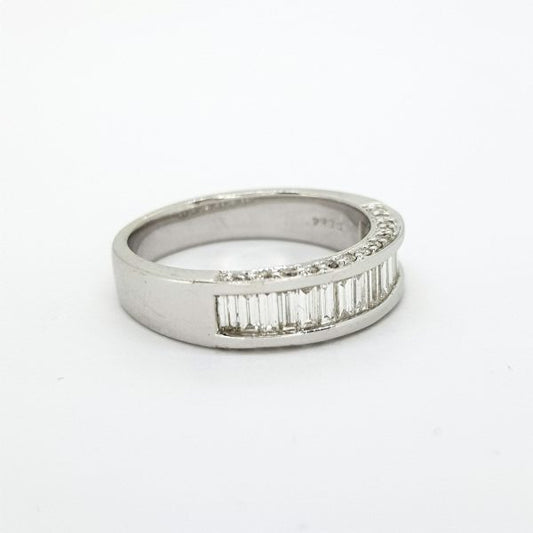 Channel Set Baguette Cut Diamond Half Eternity Ring, 0.84 carat total, accented with brilliant cut diamonds to the sides of the mount, in 18ct white gold