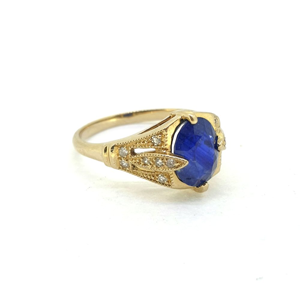 Vintage Oval Blue Sapphire and Diamond Trefoil Shoulders Engagement Ring