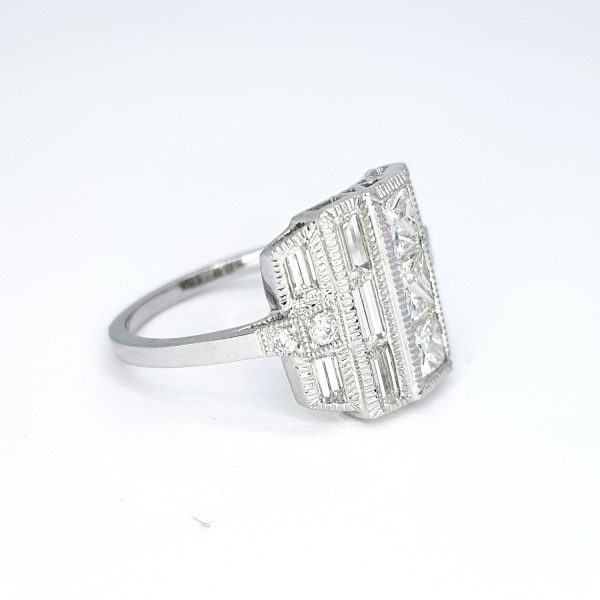 Diamond Dress Ring in 18ct White Gold, 2.63 carat total, three princess-cut diamonds flanked by baguette cut diamonds, brilliant-cut diamond set shoulders