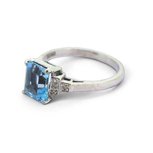Aquamarine and Diamond Engagement Ring, rectangular step-cut aquamarine flanked by stepped brilliant-cut diamond-set shoulders in 18ct white gold